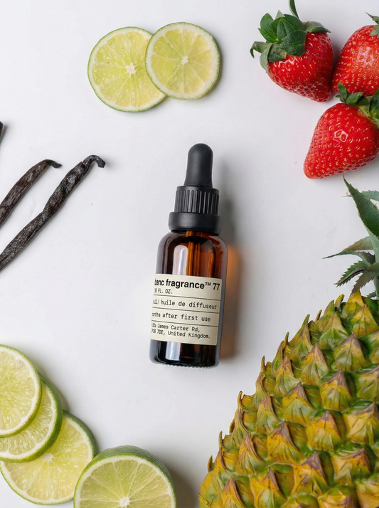 Charabanc Fragrance NO.77 Pineapple Bliss Noir essential oil bottle featuring notes of creamy pineapple, vanilla, and warm musk for a sophisticated tropical ambiance.