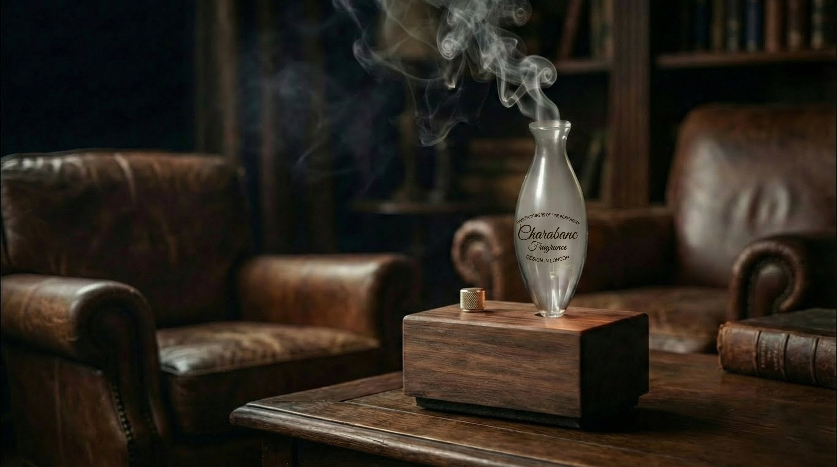 "A vertical mobile banner showing a close-up of a hand pouring Santal 26 pure essential oil into the glass nebulizer of the Charabanc waterless wood diffuser. A gentle wisp of aromatic vapor rises against a warm, sunlit living room background with a cozy white sofa, illustrating the start of an aromatherapy ritual."